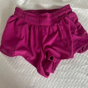 Lululemon size 2, 2.5 inch shorts in the color ripen raspberry.